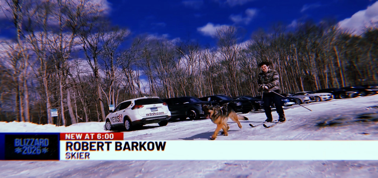 Oxford CT blizzard photo of Robert Barkow being pulled by his German Shepherd Arya to work at Entirtek, featured in WTNH News 8